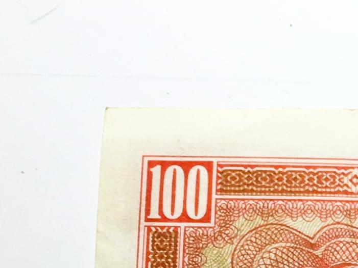 billetes de 100 decimos y 500 escudos.